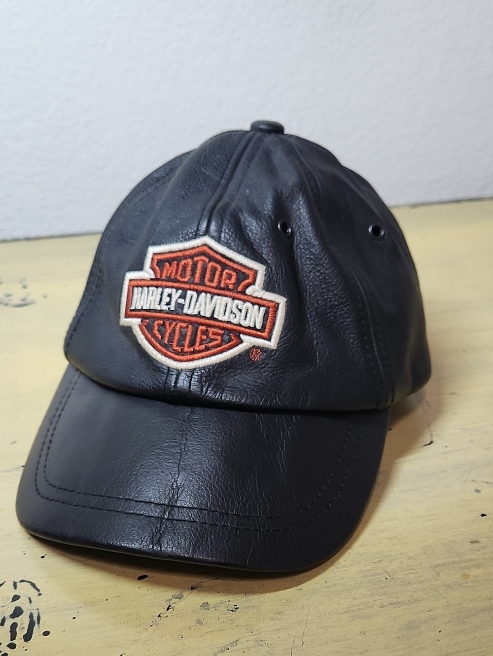 Harley-Davidson Vintage Black Leather Cap with Orange & White Patch